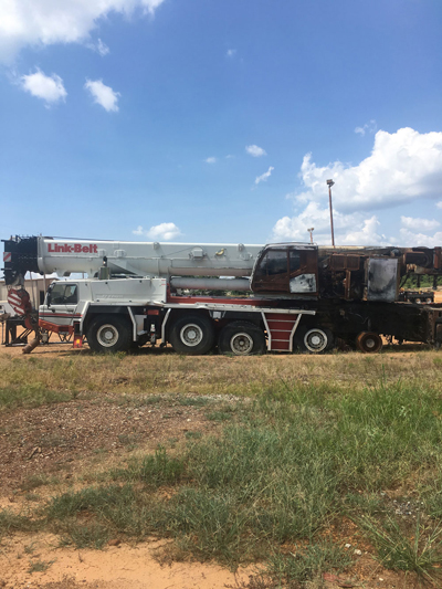Export Logistics & Shipping, Inc. inspects LinkBelt ATC3200 crane for damages